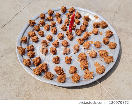 Urad Dal vadi or mong dal warian masala food drying in sunlight. it is Indian favourite food Urad Dal vadi or mong dal warian masala food drying in sunlight. it is Indian favourite food 120970872