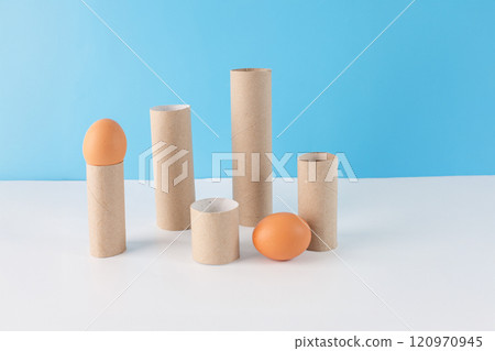 Empty toilet paper roll tubes and household paper towel rolls for creative project and DIY. Materials for craft tutorial, part of process, front view. Eco-friendly craft supplies for upcycling ideas Empty toilet paper roll tubes and household paper towel rolls for creative project and DIY. Materials for craft tutorial, part of process, front view. Eco-friendly craft supplies for upcycling ideas 120970945