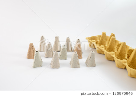 egg carton cones, part of the packaging material, possibly used for DIY craft project and creative activities, sustainable and recyclable packaging solutions 120970946