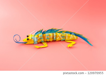DIY paper craft lizard, recycled egg carton box in use, 120970955