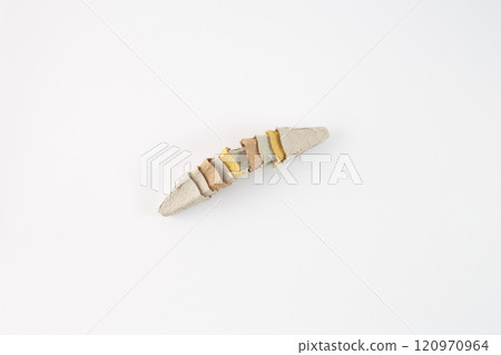 carton egg box cones arranged in a row, with each cone slightly overlapping the next. The cones are in various colors, including shades of gray, brown, and yellow. themes creative use of materials 120970964