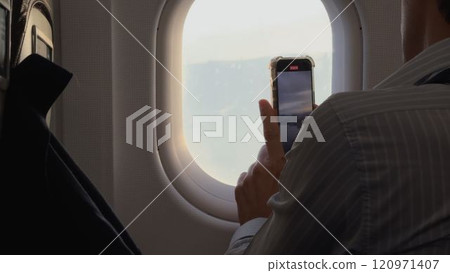 Capturing Coastal Views from Airplane Window on Business Trip Capturing Coastal Views from Airplane Window on Business Trip 120971407