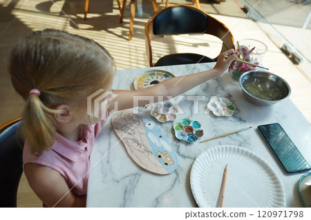 A young mother and her daughter enjoy a creative art session at home A young mother and her daughter enjoy a creative art session at home 120971798