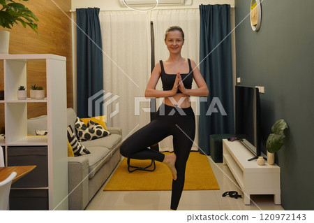 A young woman have a joyfully yoga practice  120972143