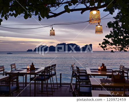 A beautiful and serene sunset scene showcasing glowing lanterns 120972459