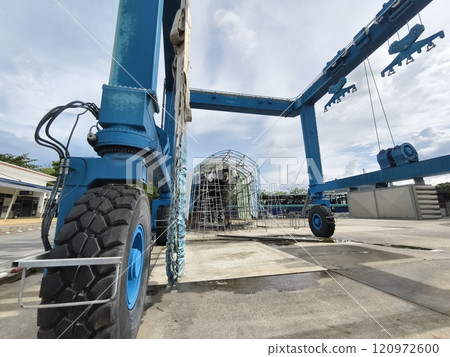 A large blue gantry crane for boats 120972600