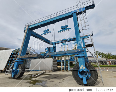 A large blue gantry crane for boats A large blue gantry crane for boats 120972656