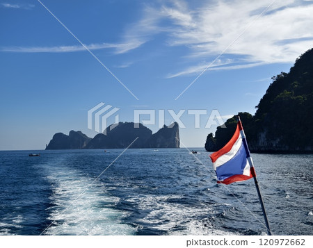 A serene and tranquil island landscape featuring crystal clear water 120972662