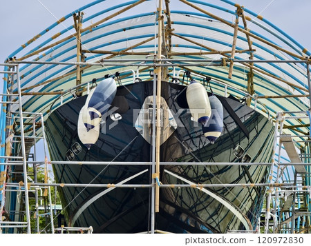 A large blue gantry crane for boats 120972830