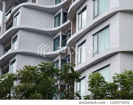 Detailed view of windows, doors and balconies of city buildings  120973042