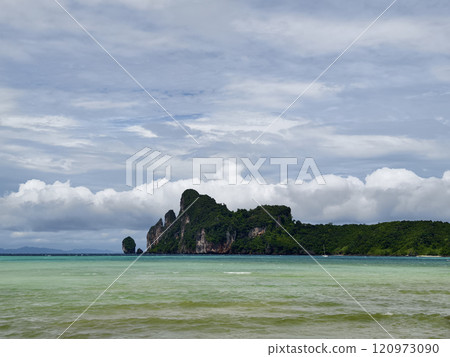 A serene and tranquil island landscape featuring crystal clear water A serene and tranquil island landscape featuring crystal clear water 120973090