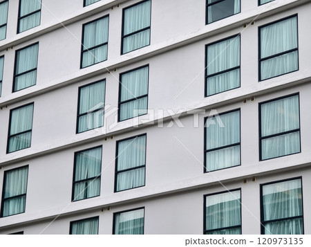 Detailed view of windows, doors and balconies of city buildings  120973135