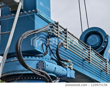 A large blue gantry crane for boats A large blue gantry crane for boats 120973156