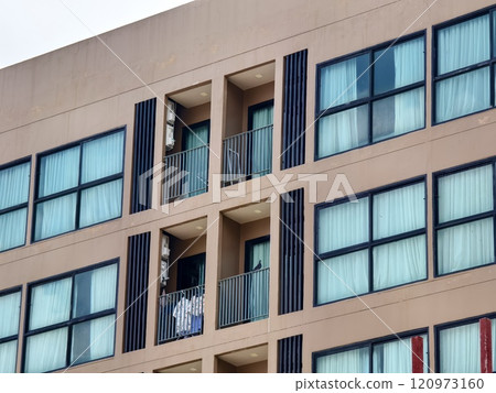 Detailed view of windows, doors and balconies of city buildings Detailed view of windows, doors and balconies of city buildings 120973160