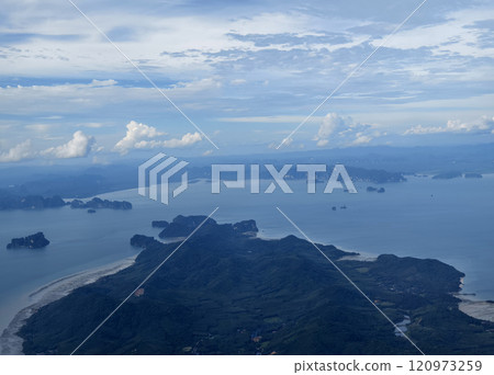 A breathtaking view of the vast ocean as seen from an airplane window A breathtaking view of the vast ocean as seen from an airplane window 120973259