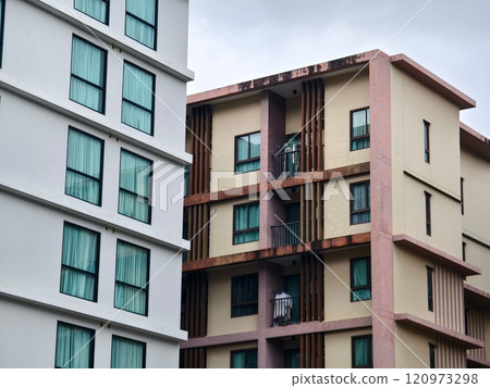 Detailed view of windows, doors and balconies of city buildings  120973298