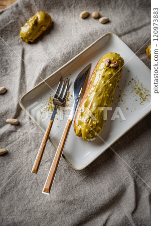 Glazed mini eclairs 120973883