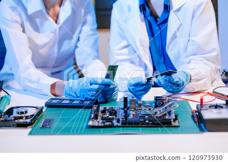 Electronics assembly and RAM installation with high-tech components. Ideal for showcasing advanced technology Electronics assembly and RAM installation with high-tech components. Ideal for showcasing advanced technology 120973930