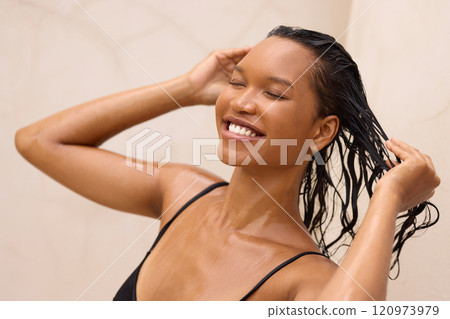 Woman Enjoying Refreshing Shower While Washing Her Hair 120973979
