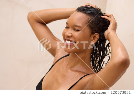 Relaxed Woman Enjoying Refreshing Spa Treatment with Happy Smile 120973991