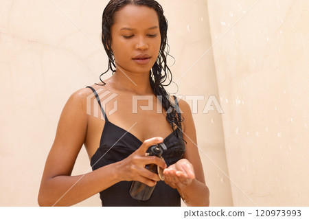 Relaxing Shower Routine Highlighting Natural Hair Care and Self-Care Moment Relaxing Shower Routine Highlighting Natural Hair Care and Self-Care Moment 120973993