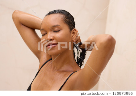 Relaxed Woman Enjoying Spa Shower in Peaceful and Serene Setting Relaxed Woman Enjoying Spa Shower in Peaceful and Serene Setting 120973996