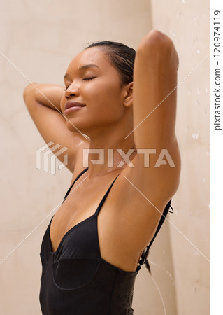 Relaxed Woman Enjoying Refreshing Shower for Ultimate Self-Care and Relaxation Relaxed Woman Enjoying Refreshing Shower for Ultimate Self-Care and Relaxation 120974119