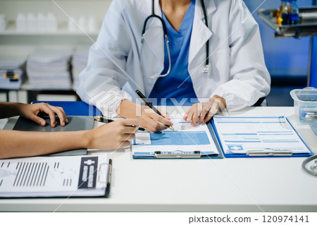 Medical technology network team meeting concept. Doctor hand working with smart phone modern digital tablet and laptop 120974141