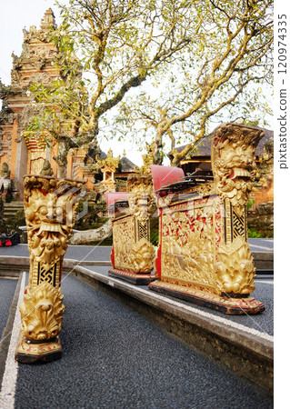 Golden Musical instrument in Ancient Pagoda of Portal von Taman Saraswati temple in Ubud city landmark on Bali Island of Indonesia. Travel destination for culture of Asian 120974335