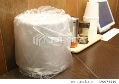 A trash can on a restaurant table (Korea) 120974349