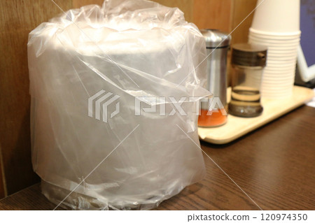 A trash can on a restaurant table (Korea) 120974350