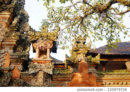 Ancient stone wall of Portal von Taman Saraswati temple in Ubud city landmark on Bali Island of Indonesia. Travel destination for culture of Asian 120974556