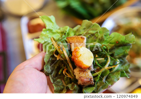 Korean barbecue food. Lettuce , Sesame leaf and meat wrap Korean barbecue food. Lettuce , Sesame leaf and meat wrap 120974849