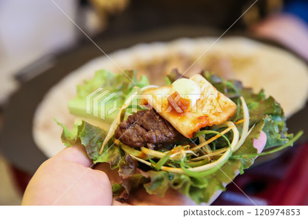 Korean barbecue food. Lettuce , Sesame leaf and meat wrap Korean barbecue food. Lettuce , Sesame leaf and meat wrap 120974853