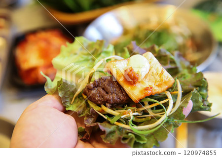 Korean barbecue food. Lettuce , Sesame leaf and meat wrap Korean barbecue food. Lettuce , Sesame leaf and meat wrap 120974855