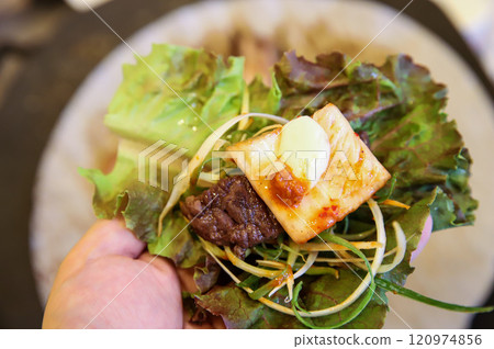 Korean barbecue food. Lettuce , Sesame leaf and meat wrap Korean barbecue food. Lettuce , Sesame leaf and meat wrap 120974856