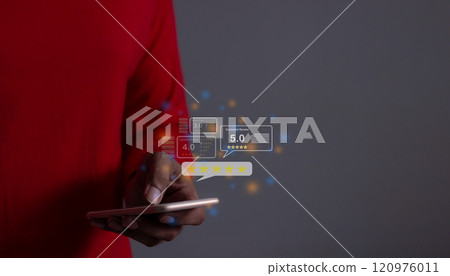 Customer Review, Young Man hand using smartphone mobile with five star to review  120976011