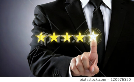 Five stars and a businessman pointing at it with his finger 120976530