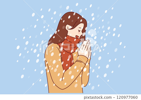 Woman enjoys winter weather, stands under falling snow flakes in sweater and scarf Woman enjoys winter weather, stands under falling snow flakes in sweater and scarf 120977060