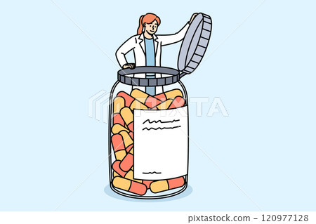 Woman doctor takes out vitamins in form of capsules from giant medicine bath to treat patient Woman doctor takes out vitamins in form of capsules from giant medicine bath to treat patient 120977128
