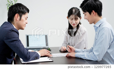 A man signing a real estate contract 120977265