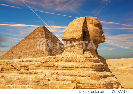 The Great Sphinx and the Pyramid of Cheops in the sands of Giza desert, Egypt The Great Sphinx and the Pyramid of Cheops in the sands of Giza desert, Egypt 120977434