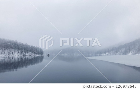 Winterscape with coniferous forest reflected in the lake.Plitvice lakes.Croatia Winterscape with coniferous forest reflected in the lake.Plitvice lakes.Croatia 120978645