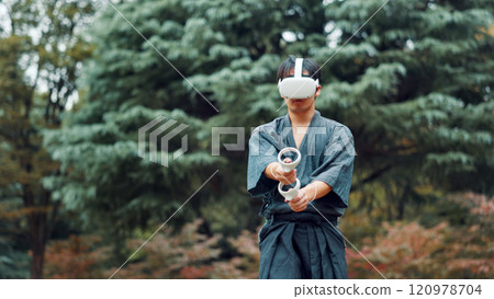 Virtual reality, park and Asian man with controller for martial arts, Kendo practice and exercise. Culture, Japan heritage and person with shinai, VR tech and goggles for skills, fight and training Virtual reality, park and Asian man with controller for martial arts, Kendo practice and exercise. Culture, Japan heritage and person with shinai, VR tech and goggles for skills, fight and training 120978704