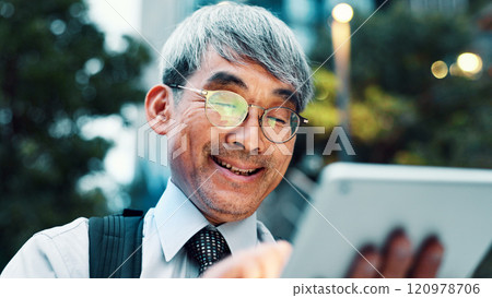 Outdoor, businessman and smile with tablet on internet for stock exchange rates in Japan. Mature person, city and happy as employee in finance on website or app for market share or investment returns Outdoor, businessman and smile with tablet on internet for stock exchange rates in Japan. Mature person, city and happy as employee in finance on website or app for market share or investment returns 120978706