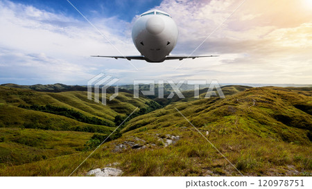 Commercial airplane flying in the sky above the mountain range with cloudscapes background Commercial airplane flying in the sky above the mountain range with cloudscapes background 120978751