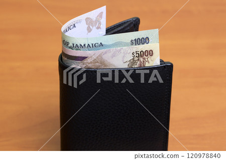 Jamaican dollar in the black wallet Jamaican dollar in the black wallet 120978840