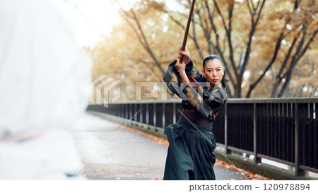 City, bamboo sword and Asian people on bridge for martial arts, Kendo practice and exercise. Culture, heritage and person with shinai for skill challenge, fight and training with sensei in Japan City, bamboo sword and Asian people on bridge for martial arts, Kendo practice and exercise. Culture, heritage and person with shinai for skill challenge, fight and training with sensei in Japan 120978894
