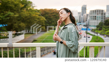 Fitness, city and Asian woman with music earphones for running, outdoor training and sports routine. Exercise, podcast and Japanese female runner on bridge with radio, track and song audio in Japan Fitness, city and Asian woman with music earphones for running, outdoor training and sports routine. Exercise, podcast and Japanese female runner on bridge with radio, track and song audio in Japan 120979140
