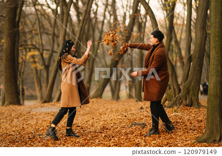 Young couple in love walking in the park on a autumn day. Enjoying time together. 120979149